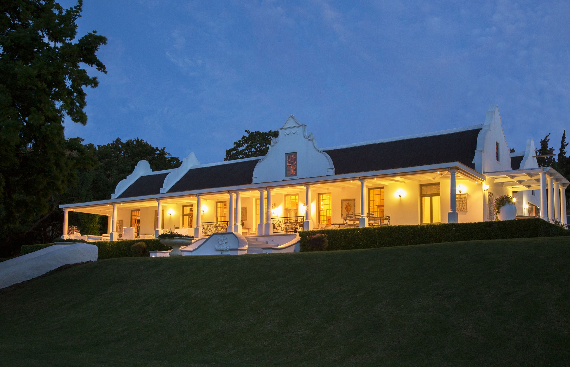 Luxury house and porch illuminated at night