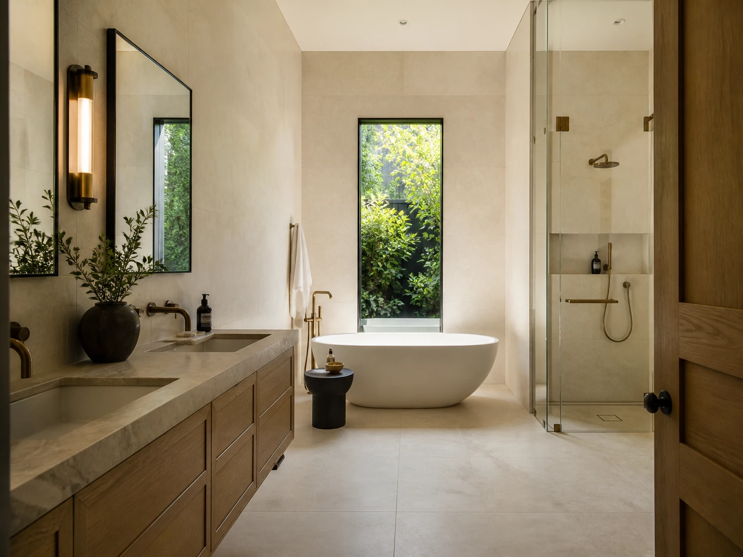 Finished modern bathroom with pale oak vanity and freestanding tub